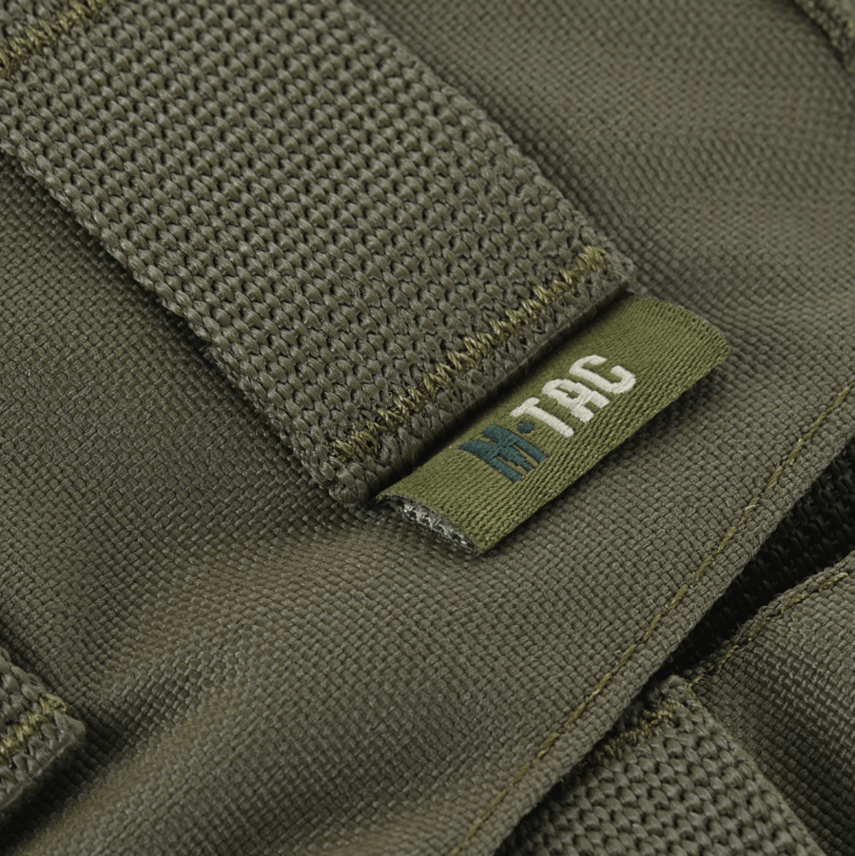 Nærbillede af M-Tac War Belt ARMOR, lavet af slidstærkt Cordura 500D med MIL-SPEC MOLLE-webbing til taktiske formål.