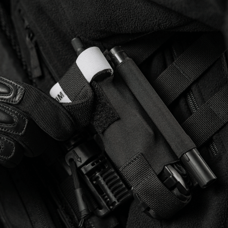 M-Tac Elastisk Tourniquet Pouch Molle Gen.III-pose på en taktisk vest.