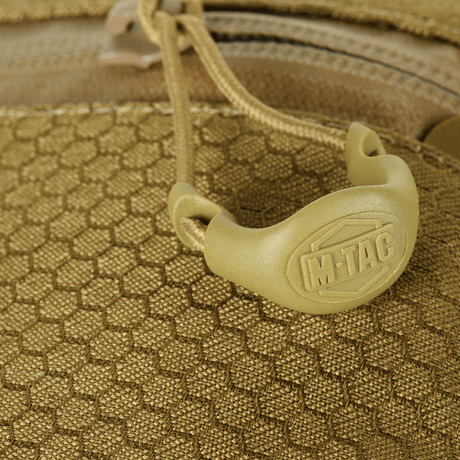 Nærbilde av M-Tac Cross Bag Elite Hex med Cordura 500-materiale og YKK-lynlåsdetalj.
