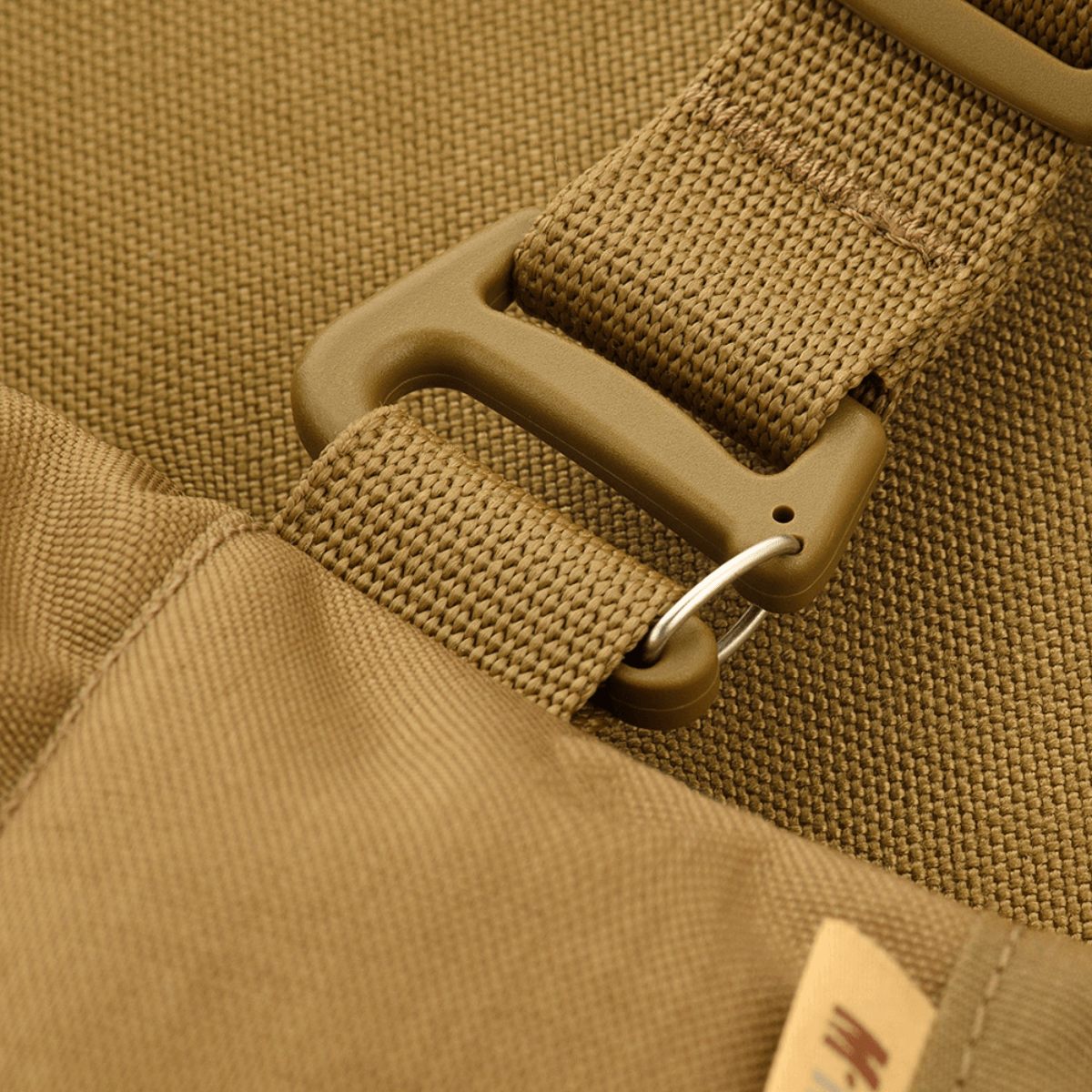 Nærbillede af M-Tac Taktisk Håndvarmer Elite, der viser slidstærkt Cordura 500D materiale og spænde detalje.