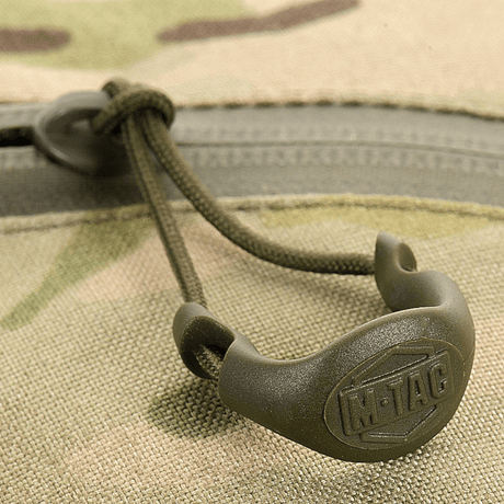 Nærbilde av M-Tac Sling pistolveske Elite Hex-lynlås, som viser slitesterkt Cordura 1000D-materiale.