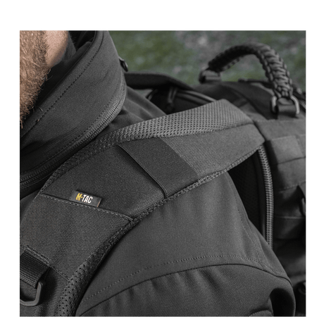 Detaljert bilde av M-Tac Mission Pack Elite ryggsekk i Cordura 1000D med MOLLE LASER CUT-system for økt funksjonalitet og holdbarhet.
