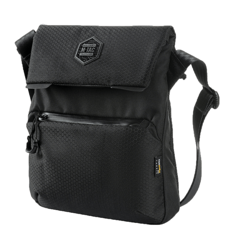 M-Tac Konvert Taske Elite i svart, laget av holdbart Cordura-materiale med justerbar skulderrem og magnetventil-lukking.