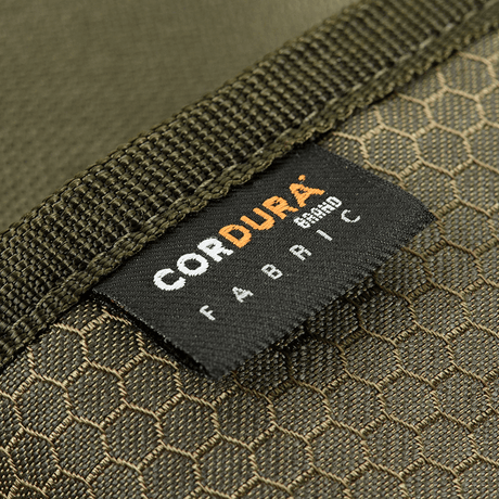 Nærbilde av M‑Tac Pung Elite Gen.II Hex med Cordura Hex 1000D-stoffmerke, som viser slitesterkt og robust materiale.