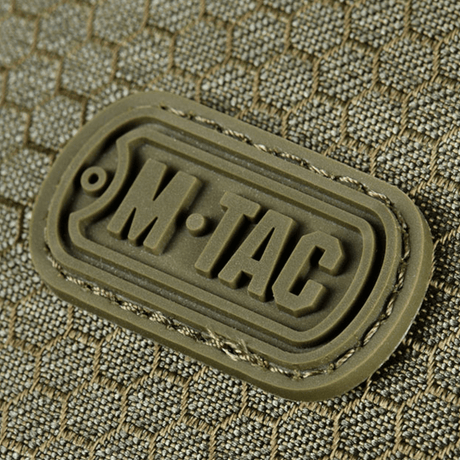 M-Tac Cross Taske Slim Elite Hex-logo på en stilfull veske laget av Cordura-materiale, viser produktets holdbarhet og kvalitet.