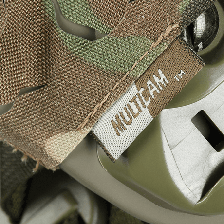 M‑Tac Vilha Hjelmcover FAST i Multicam-mønster, laget av slitesterkt Cordura 500D, designet for kamuflasje og beskyttelse på hjelmer.