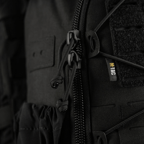 M-Tac STURM Elite ryggsekk med laserskåret MOLLE-frontpanel, nærbilde av glidelås og detaljer, laget av Cordura-materiale.