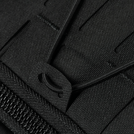 Detalj av M-Tac STURM Elite ryggsekk med Cordura-stoffer og robuste glidelåser for taktisk bruk.