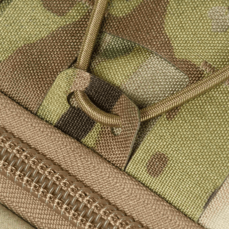 Nærbilde av M-Tac STURM Elite ryggsekk med kamuflasjemønster, Cordura-materiale og YKK glidelås.