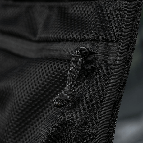 M-Tac STURM Elite ryggsekk, detaljvisning av mesh-lomme, svart Cordura-materiale med glidelås, designet for taktisk bruk.