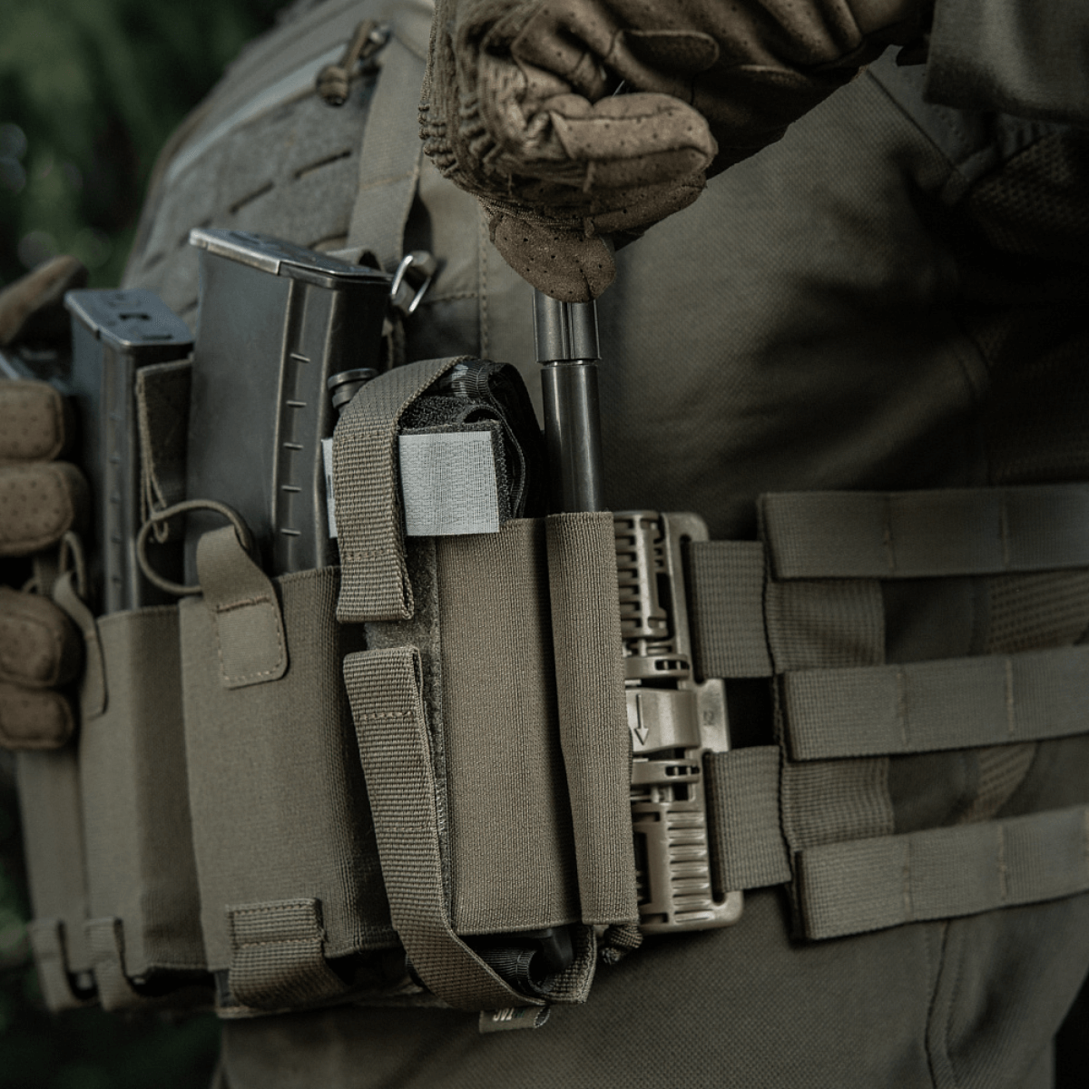Soldier wearing M‑Tac Tourniquet Pouch Elastic Gen.5 with tactical gear in outdoor setting
