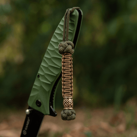 M-Tac Knife Lanyard Celtic i flettet paracord-stil, viser unik dekorasjon til kniv og verktøy, perfekt for bærbar bruk og personlig stil.