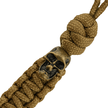 M-Tac Loopy Snake Skull Lanyard i flettet paracord, designet for kniver og utstyr, med dekorativt dødningehode.