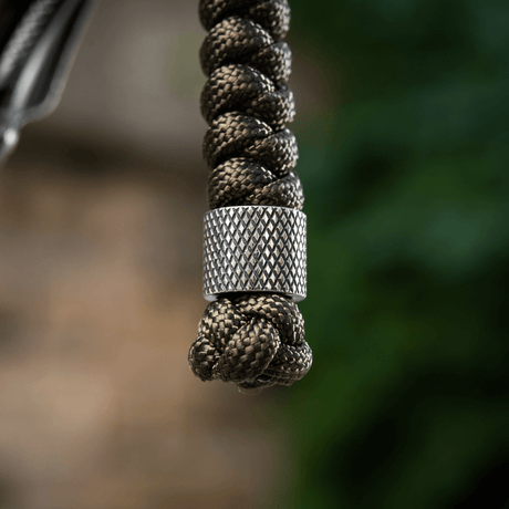 M-Tac Viper Lanyard Stainless Steel med flettet paracord og rustfri stålperle, fleksibelt knivetilbehør for rask tilgang.