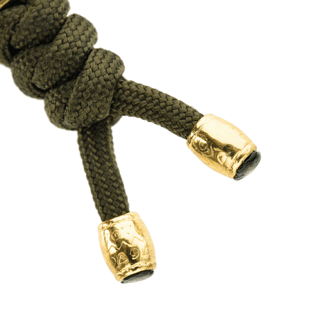 M-Tac Zeus Lanyard i flettet paracord med stilfullt design og gylne ender, perfekt for oppbevaring av kniv og utstyr.