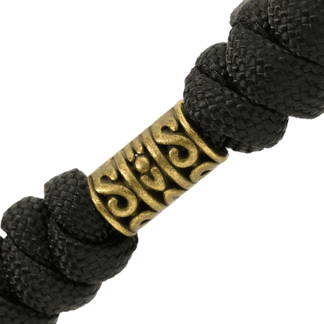 M-Tac Zeus Lanyard i flettet paracord med messingdetalj, ideell for rask tilgang til kniv og utstyr, stilfullt og fleksibelt design.