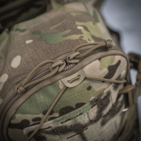 M-Tac ryggsekk Sturm Elite Gen.II i kamuflasjestoff med kraftige glidelåser og MOLLE Laser Cut-system for ekstra utstyr.