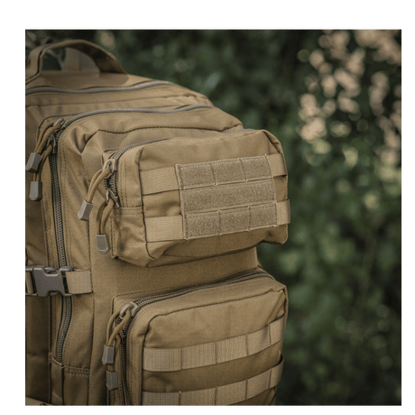 M-Tac Large Assault Pack ryggsekk i taktisk design med MOLLE-system og ekstra lommer, sett i tett skogområde.
