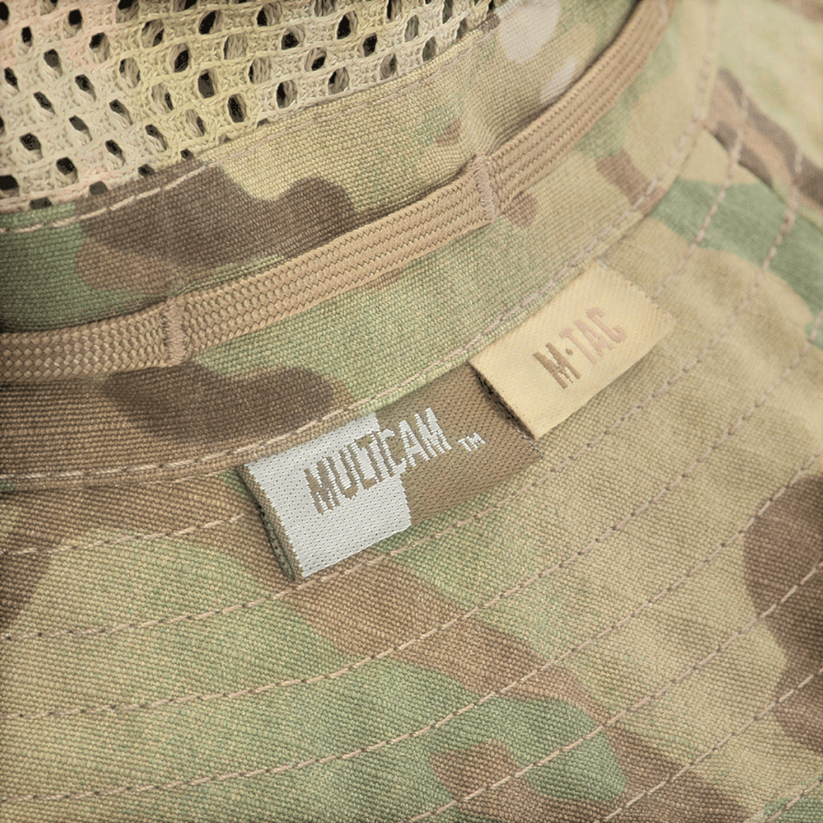 M-Tac Panamahat med Net Elite NYCO med camouflageprint og mesh-design, vis detaljer af båndsyet kant og snor.