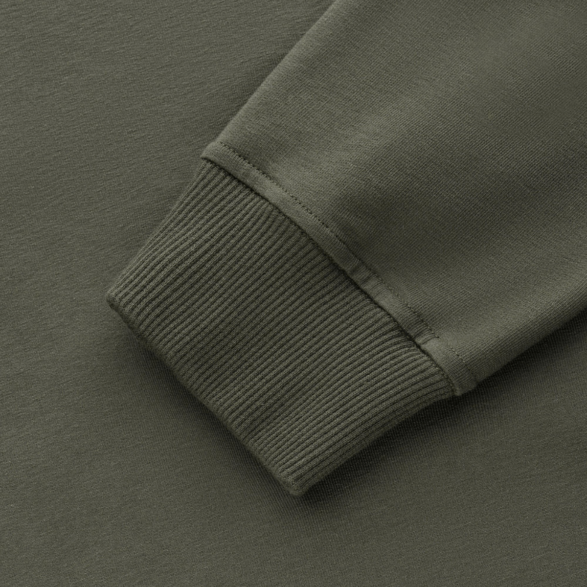 Detaljebillede af manchet på M-Tac Pullover 4 Seasons i grøn, lavet af elastisk stof til alsidig brug.