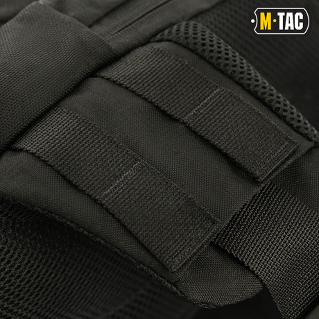 M-Tac Buckler Taske Elite med MOLLE-system i svart Cordura 500D, nær visning av design og stropper.