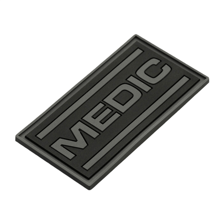 M-Tac Patch Medic PVC 3D taktisk patch med Velcro, med svart design og 3D-effekt. Dimensjoner: 70 x 35 mm. Perfekt for uniformer og vesker.