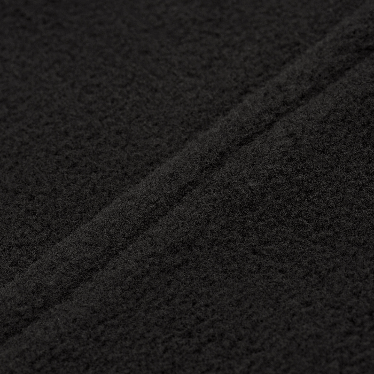 Nærbillede af M-Tac Delta Fleece Jakke materiale, viser fleece struktur og kvalitet, perfekt til udendørs aktiviteter og koldt vejr.