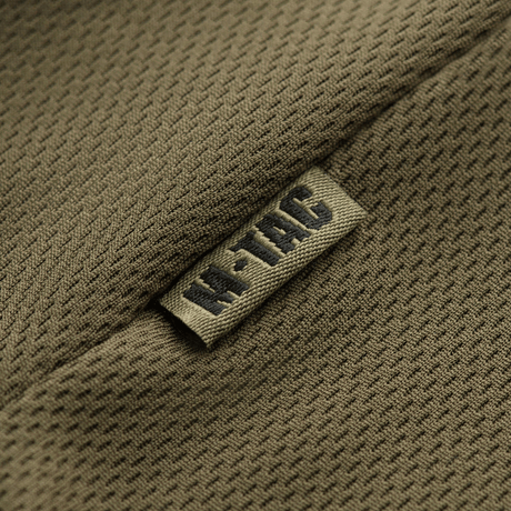 M-Tac Polo Elite Tactical Coolmax med åndbart Coolmax®-stof, udformet til politi og sikkerhedsarbejde, nærbillede af stoffets tekstur.