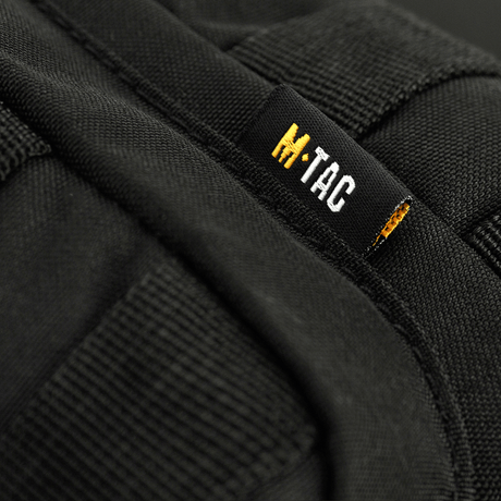 M-Tac Assistant Veske med justerbar enkeltsele og MOLLE-paneler i svart materiale 600D. Praktisk for daglig bruk.