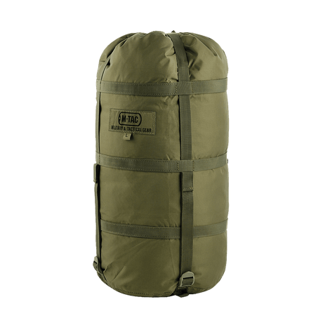 M-Tac kompresjonspose i vannavvisende nylon med stropper for plassbesparelse, ideell for sikker oppbevaring og transport av utstyr.