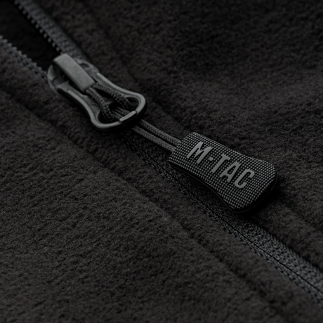 Nærbillede af M-Tac Delta Fleece Jakke lynlås, viser sort fleece stof og lynlåsdetaljer, ideel til udendørs brug i koldt vejr.
