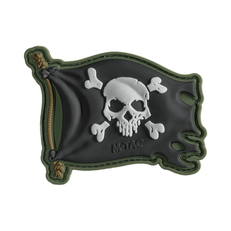 M-Tac Patch Jolly Roger PVC i 3D-design, symboliserer eventyrlyst og besluttsomhet, med Velcro på baksiden for enkel festing, 8 x 5 cm.