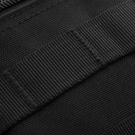 Nærbilde av M-Tac Urban Line City Patrol Fastex-veske med slitesterkt polyester og PVC-coating.