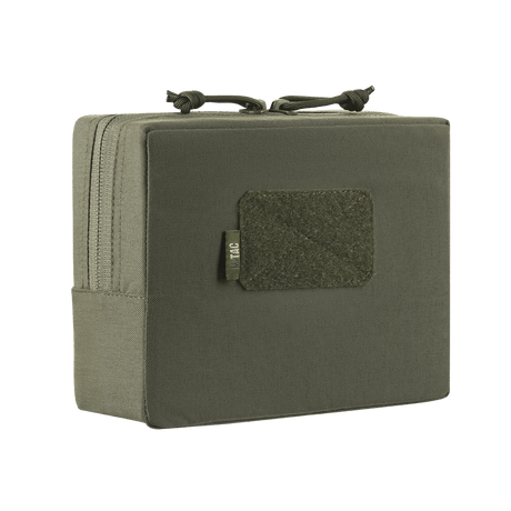 M-Tac Utility Taske Elite Medium i robust materiale med borrelåsfelt og dobbel glidelås, designet for sikker oppbevaring, vist i galleri posisjon 1.