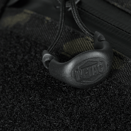 Detalj av M-Tac Sling pistolveske Elite Hex med Velcro, glidelåsdetalj med fastex.