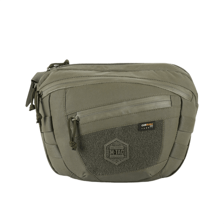 M-Tac Sphaera Hardsling Bag Large Elite med Velcro i olivengrønn med front Velcro-panel og justerbar skulderrem, laget av slitesterk Cordura.