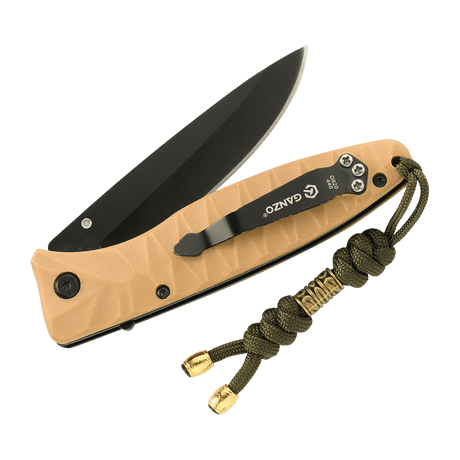 M-Tac Zeus Lanyard i flettet paracord vedhæftet til en kniv, giver nem adgang og stilfuldt design til udstyr.