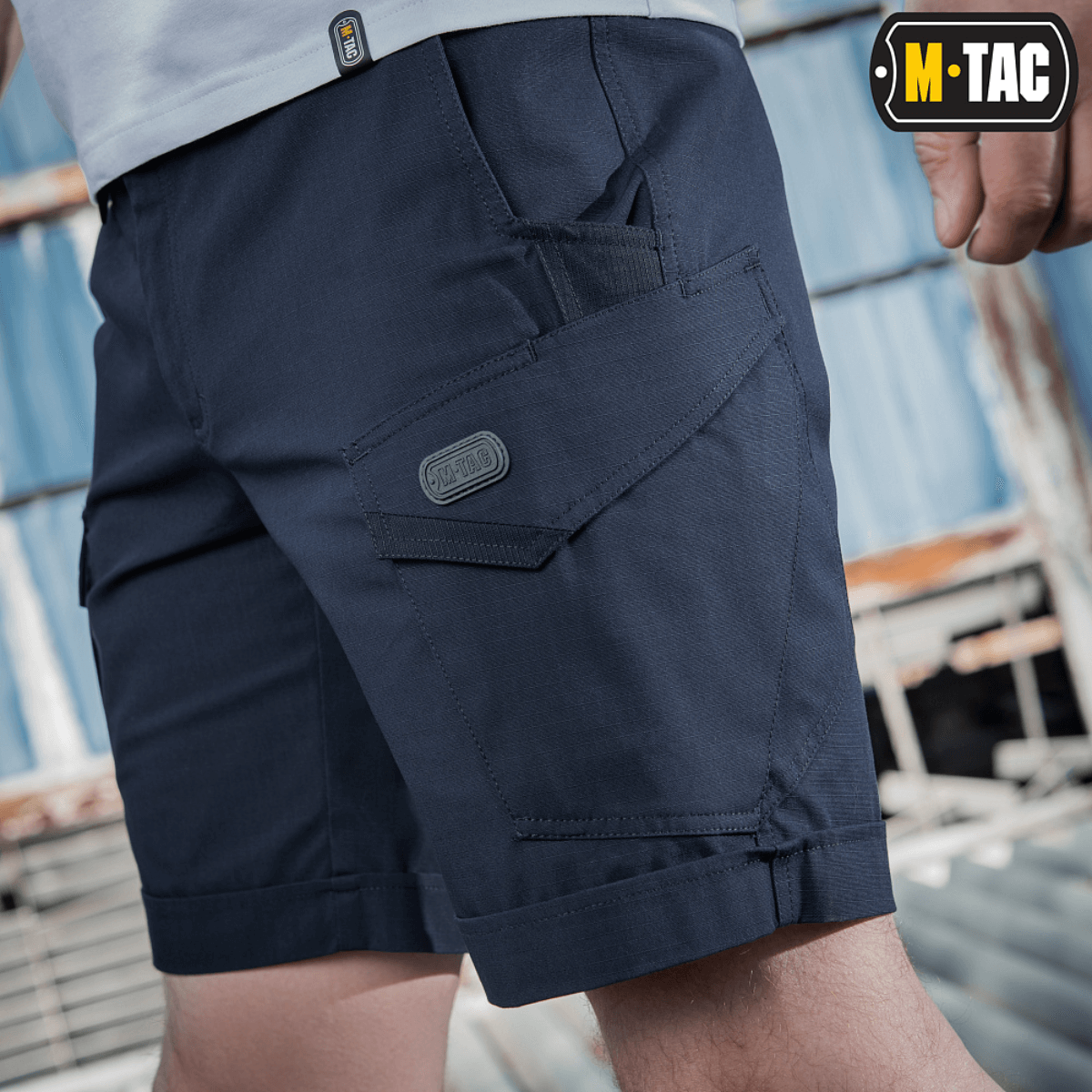 M-Tac Shorts Aggressor Short med taktiske lommer, ideel til bybrug og udendørs aktiviteter, vises i navy blå farve til mænd.