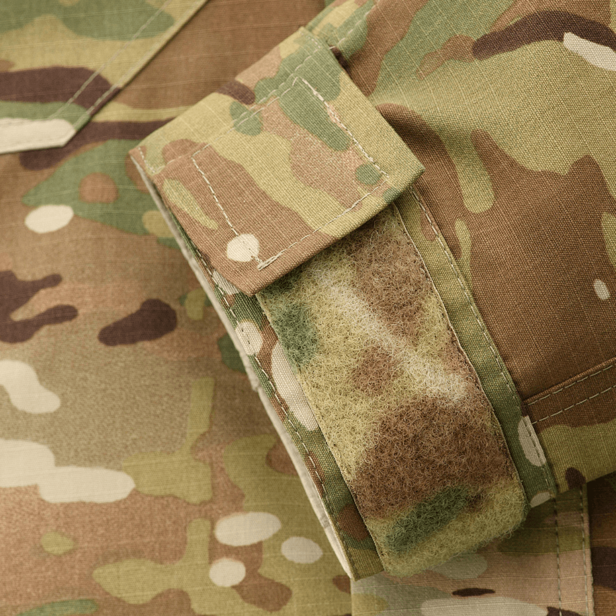 M-Tac Jakke Military Elite NYCO i MultiCam med Velcro-detaljer, fremstillet af American NYCO rip-stop stof med Teflon-behandling.
