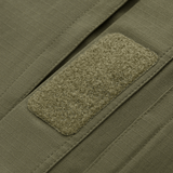 Close-up of Velcro panel on M-Tac Jakke Patrol Flex, showcasing durable tactical design in green fabric.