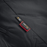 Nærbillede af M-Tac Alpha Gen.III Pro Vinterjakke med forstærket materiale og mærkeetiket.