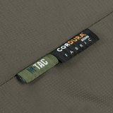 Detalje af M-Tac Alpha Gen.III Pro Vinterjakke med CORDURA stofmærke til holdbarhed og komfort.