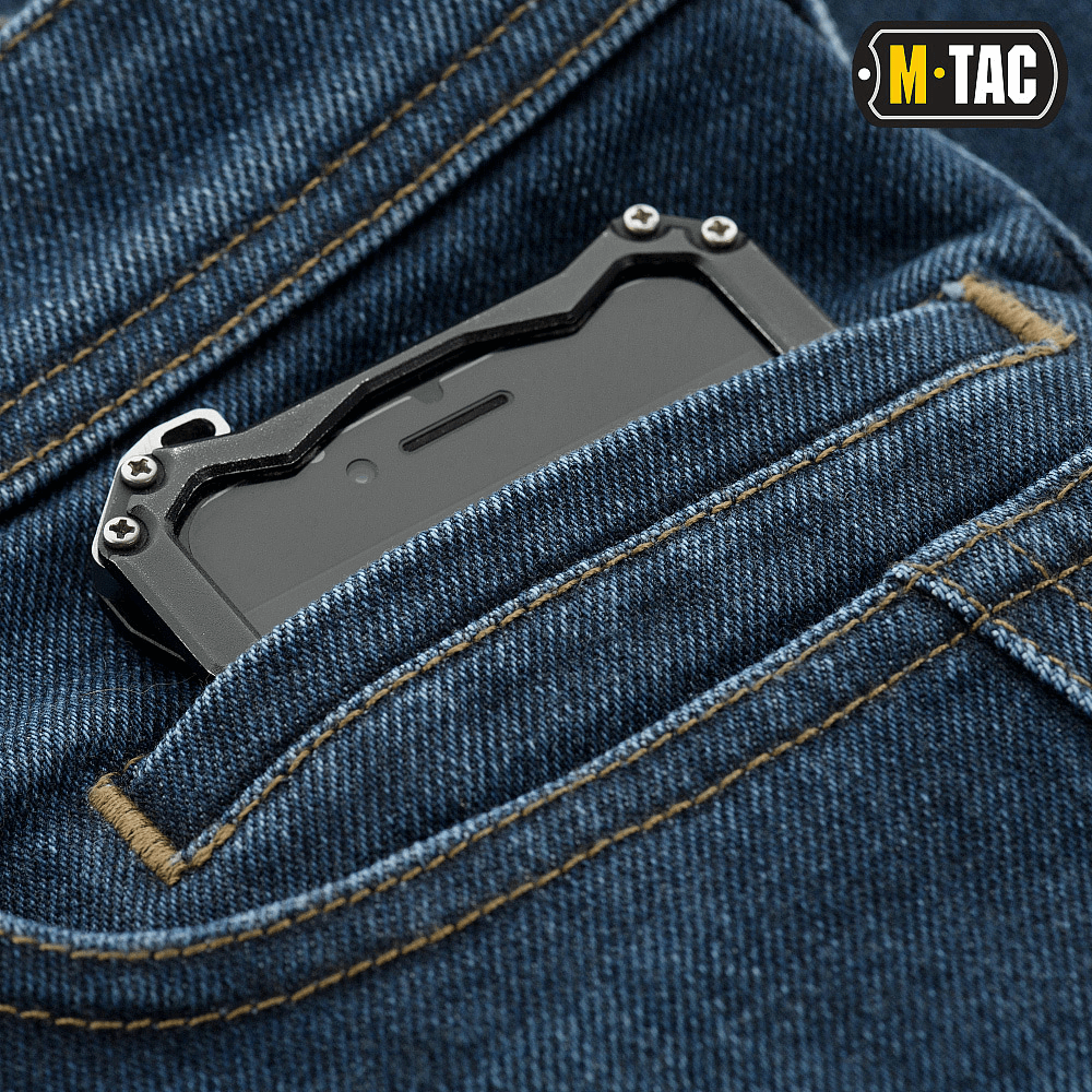 Detaljer af M-Tac Jeans Tactical Gen. I Cordura Regular Fit med smartphone i forlommen, fremhæver robust Cordura Denim stof.