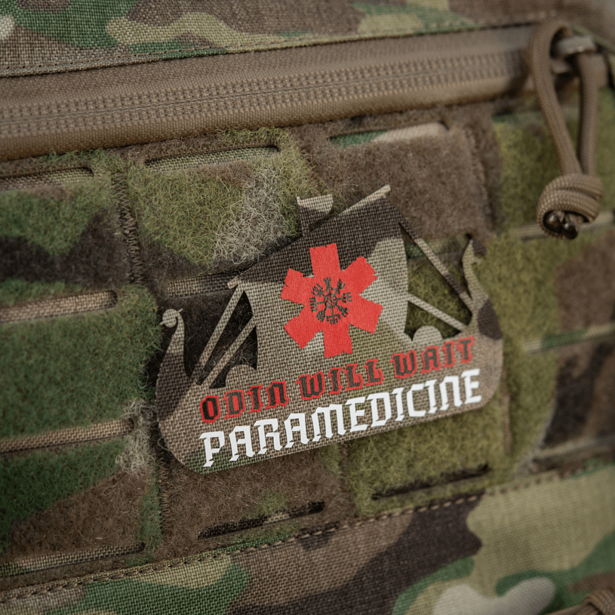 M-Tac Patch Viking Evac med vikingeskib og "Odin Will Wait Paramedicine" tekst i camouflagebaggrund.