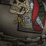 M-Tac T-Shirt Motanka med kranium-print og logo, der afspejler modigt design inspireret af ukrainsk kosak-arv og symboler.