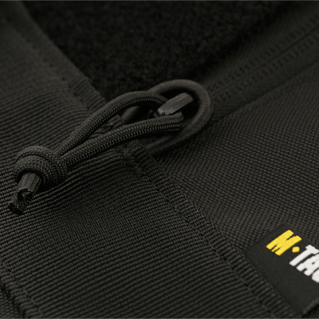 Sort lynlås detalje på M‑Tac Våbenetui 128 cm, et polstret transportetui med velcrostropper til sikker våbenopbevaring.