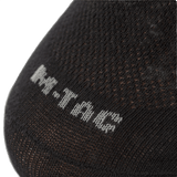 Sort M-Tac Let Sportsokker til løb og udendørsaktiviteter, med ergonomisk design og åndbart materiale.