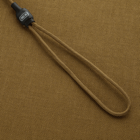 M-Tac Safety Cord Medium Universal fastgjort på beige baggrund, fleksibel spiralkonstruktion til sikring af udstyr.