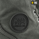 Nærbillede af M-Tac Sneakers med klassisk design og holdbart bagoverlay for udendørs brug, fokus på metalliserede snørehuller.