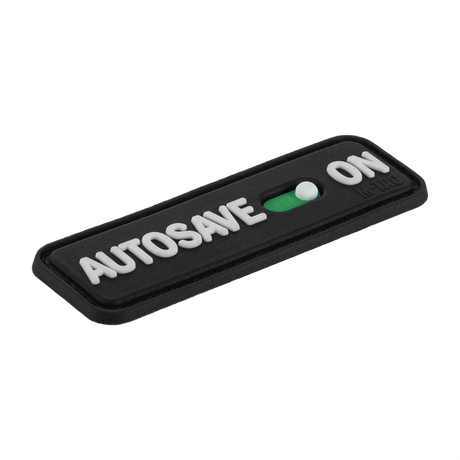 M-Tac Patch Autosave PVC med 3D-effekt og velcro, perfekt til tøj og udstyr. Dimensioner 8 x 2.5 cm, lavet af holdbar PVC.